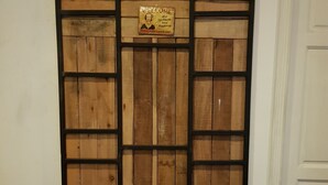 A wooden door with a welcome sign and a black metal frame. - Cozy Cabin - Hostel (Bangkok)