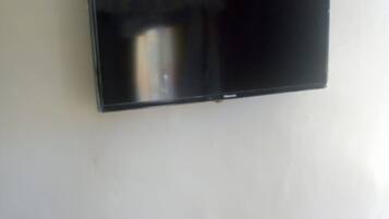 A flat-screen TV mounted on a plain wall.