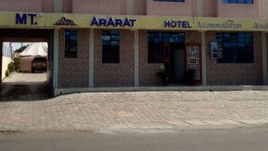 A multi-story building with a sign for 'MT. ARARAT HOTEL' and 'Accommodation Plan'. - MT Ararat Hotel (Nakuru)