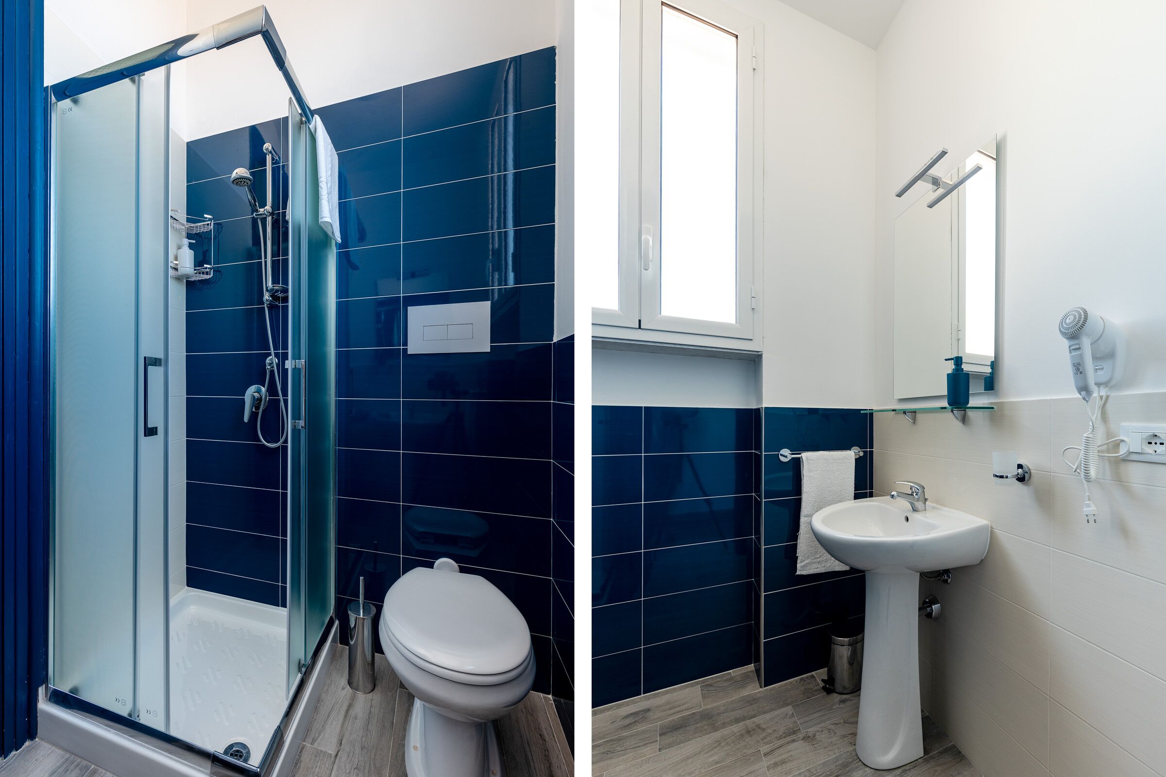 A bathroom with a glass shower enclosure, a white toilet, and a sink with a mirror above it.