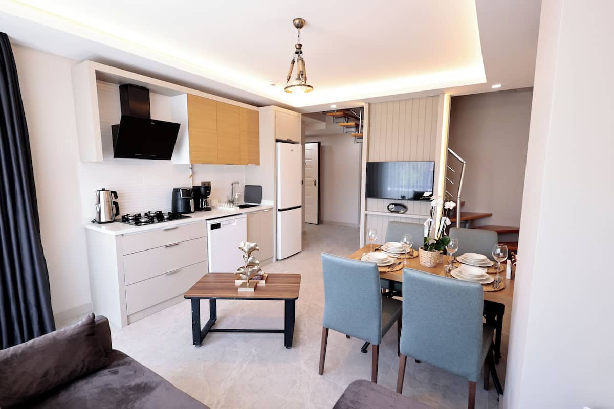 luxury duplex, multiple bedrooms, jetted tub, mountain view | living area | 120-cm smart tv with satellite channels, tv