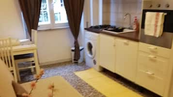 Apartment, 1 Bedroom, City View | 1 bedroom, desk, soundproofing, iron/ironing board