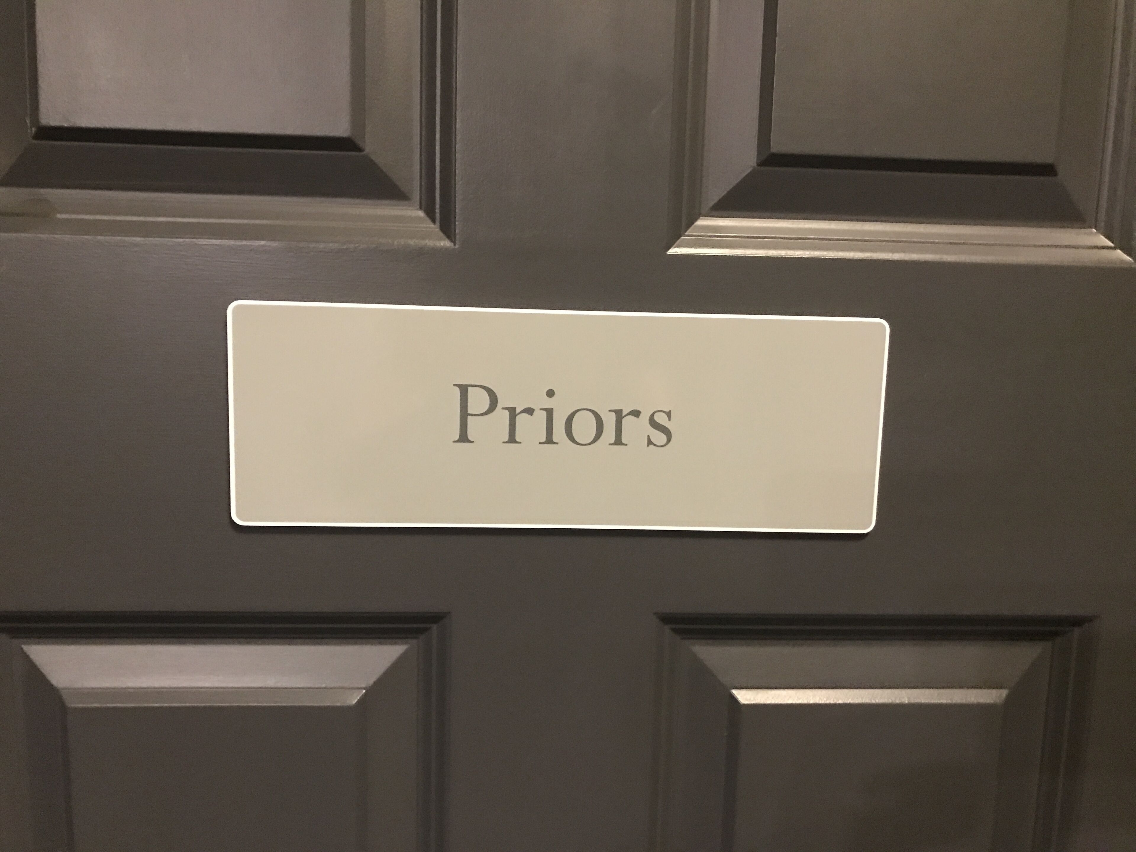 A door with a nameplate that reads "Priors".