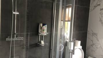 Shower, free toiletries, hair dryer, towels
