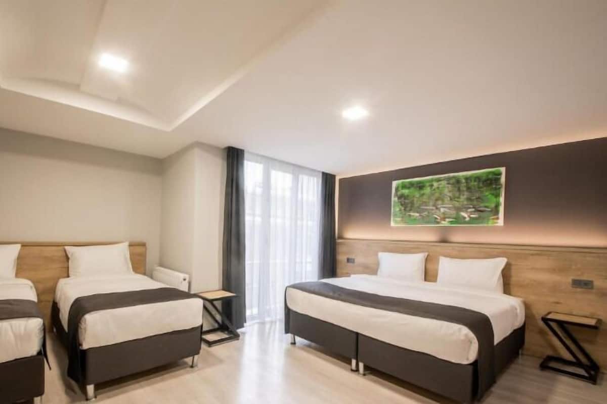 Superior Quadruple Room | Premium bedding, minibar, in-room safe, individually decorated