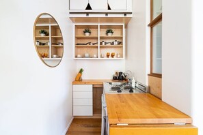 Fridge, stovetop, coffee/tea maker, cookware/dishes/utensils