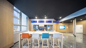 A modern conference room with a long table, four chairs, and a large window. - Holiday Inn Express Hangzhou Westlake East by IHG (Hangzhou)