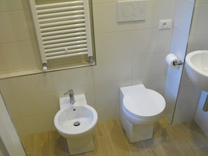 Shower, bidet, toilet paper