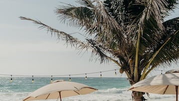 Private beach, white sand, free beach cabanas, beach umbrellas