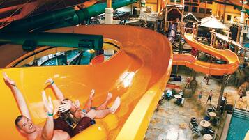 Enjoy water slides, pools, and seating areas in this vibrant indoor water park.