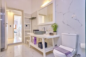 Shower, rainfall showerhead, hair dryer, towels