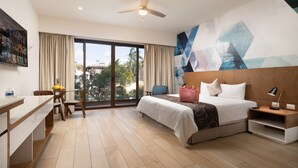 A modern hotel room with a bed, a desk, and a large window. - Tú Paraiso privado - Lahun suites Playa del Carmen  (Playa del Carmen)
