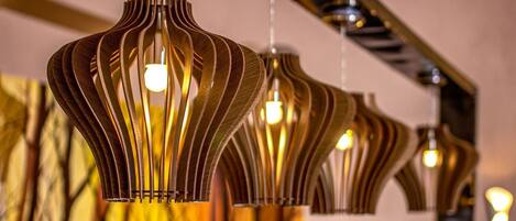A row of hanging pendant lights with a unique, ribbed design.