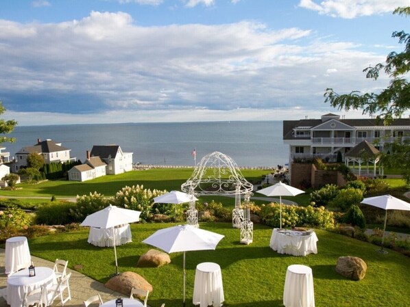 A coastal hotel with outdoor seating and a gazebo.