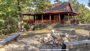 A rustic cabin with a porch, surrounded by trees. - Secluded Log Cabin, Mountain Top, Hot Tub, Pool Table, 5 Miles From Downtown (Hot Springs)