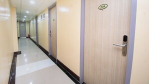 A hallway with doors numbered 204 and 205, leading to rooms.
