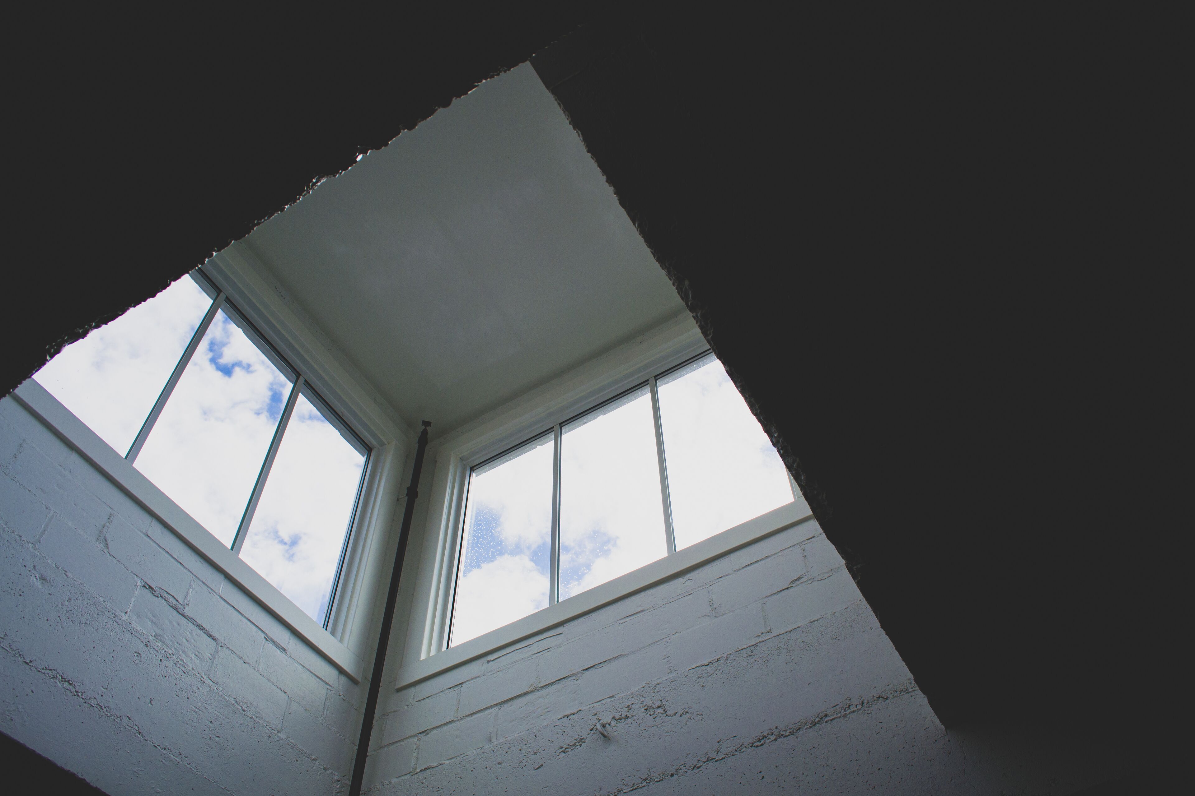 A skylight with a view of the sky.