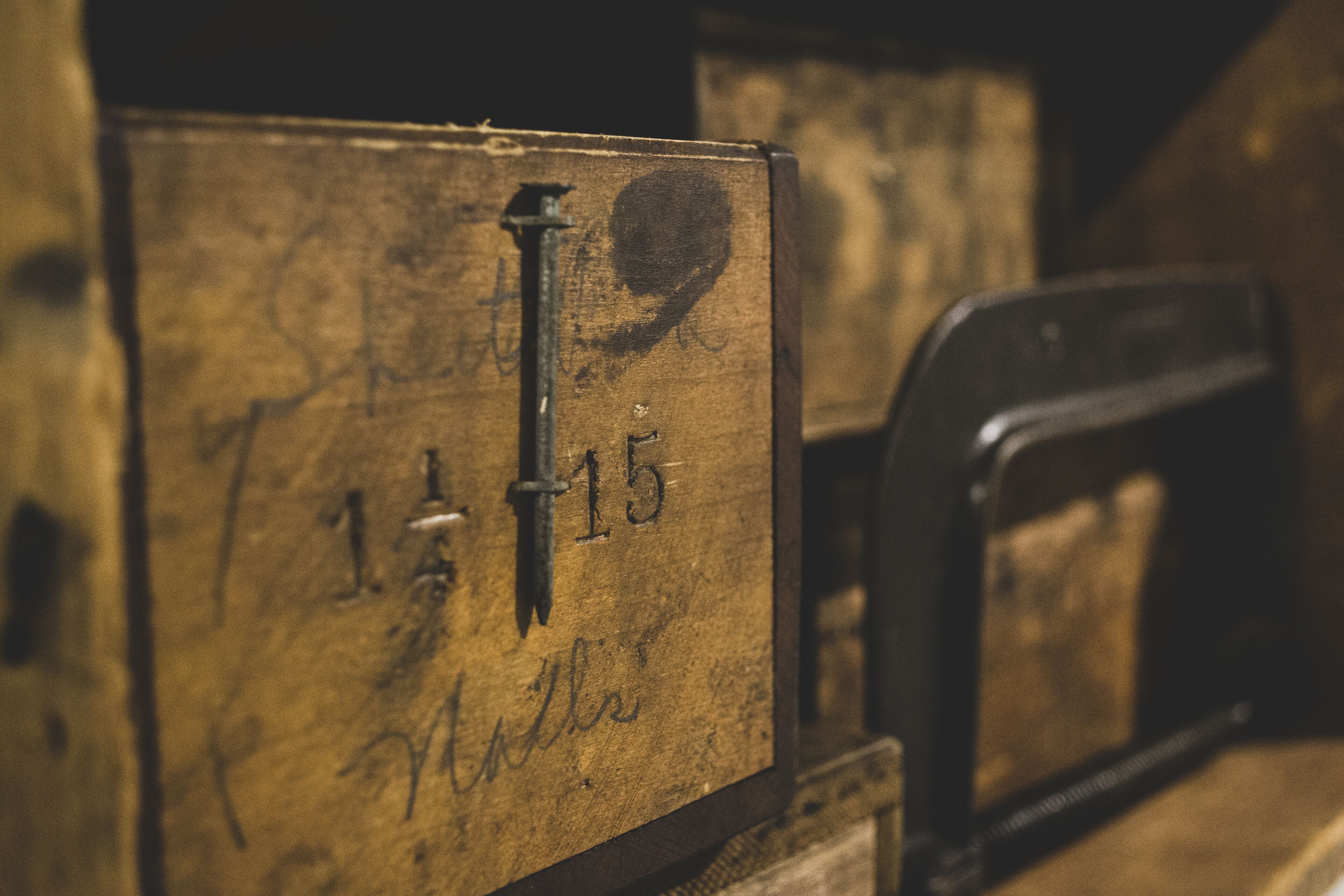 A close-up of a wooden box with the number 15 and the word "Miller" on it.