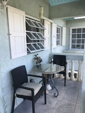 Outdoor dining - Comfy Apartment 15E in quiet Sagusta Gardens PLS with pool view (Providenciales)