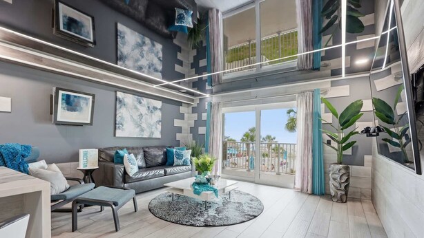 A modern living room with a sofa, coffee table, and artwork on the walls. - The Summit 231 - Corner of Paradise (Panama City)