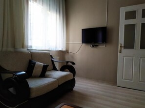 Deluxe Apartment | Living area | 18-inch LCD TV with satellite channels, TV - Step Apartments (Istanbul)