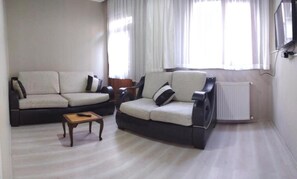 Deluxe Apartment | Living area | 18-inch LCD TV with satellite channels, TV - Step Apartments (Istanbul)