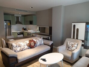 32-inch flat-screen TV with satellite channels, TV, fireplace - Haven City at Pearl in the City (Accra)