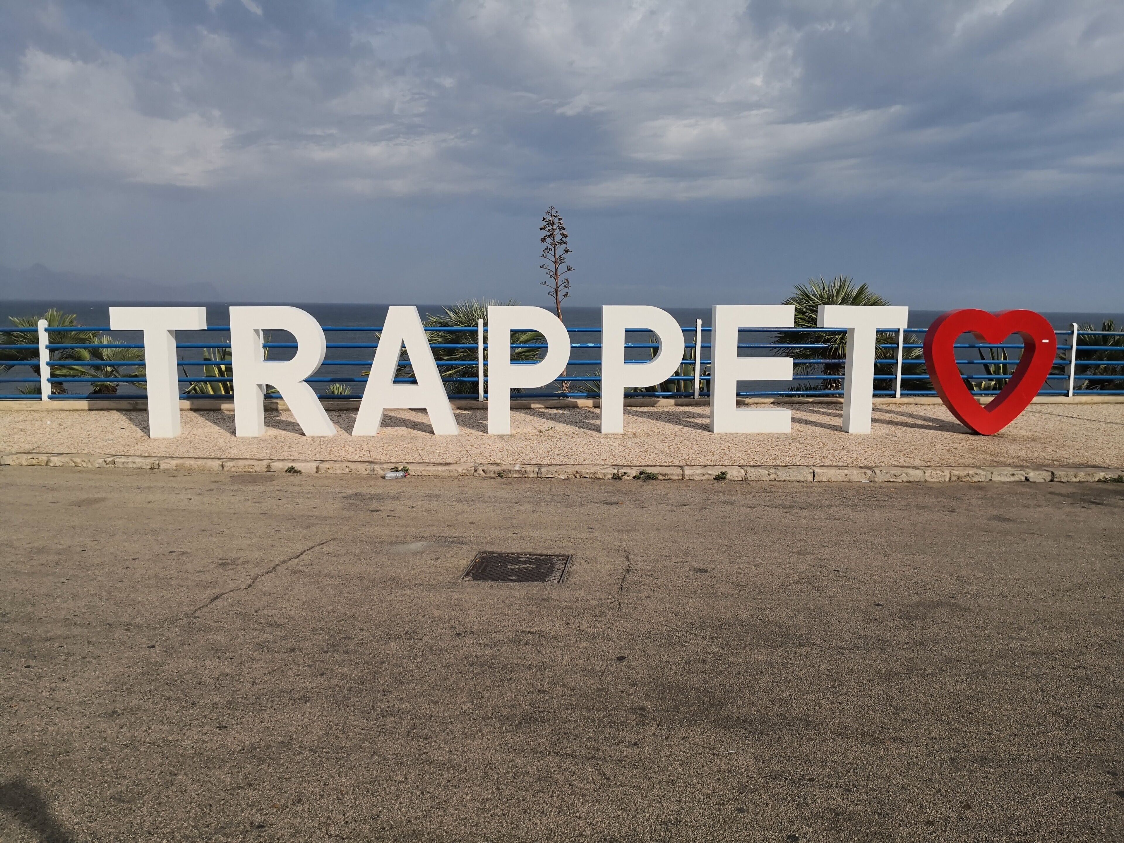 A sign with the word "TRAPPE" and a heart symbol.