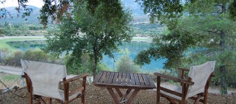 Holiday cottage with shared swimming pool and lake view in the countryside.