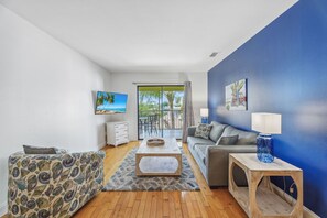 Deluxe Suite (Second Floor Only) | Living area | 50-inch flat-screen TV with cable channels, TV