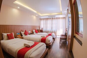 Deluxe Triple Room | Egyptian cotton sheets, premium bedding, down comforters, desk - Hotel Chhimeki (Kathmandu)