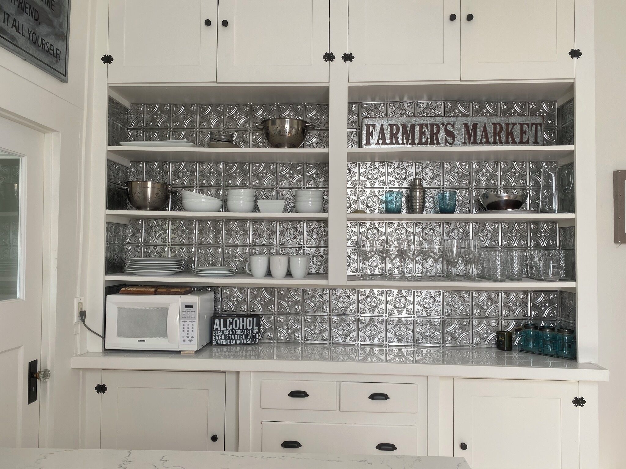 Plenty of dishes and wine glasses within close reach!