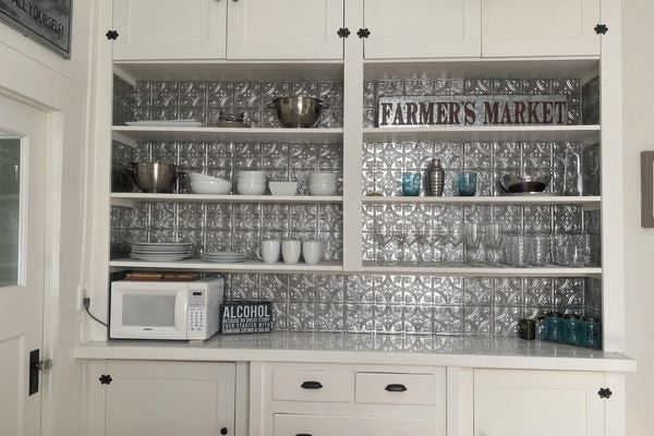 Plenty of dishes and wine glasses within close reach!