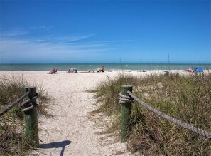 A sandy beach path leading to the ocean with people relaxing on the sand and beach chairs. - The  Bayfront House !!! (Nokomis)