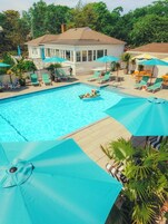 Seasonal outdoor pool, open 8:00 AM to 9:00 PM, pool umbrellas