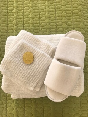 Bathtub, hair dryer, towels, soap