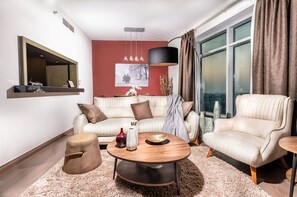 Deluxe Apartment, 2 Bedrooms | Living room | LCD TV, DVD player