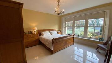 Deluxe Double Room, Ground Floor | Blackout drapes, soundproofing, iron/ironing board, free WiFi