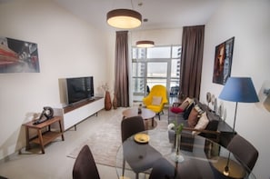 Appartement Deluxe, 1 chambre (1) | Salle de séjour | Télévision LCD