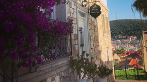 A stone building with a sign reading "Villa Veria Boutique Hotel." - Villa Veria (Cesme)