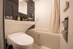 Combined shower/tub, free toiletries, hair dryer, slippers