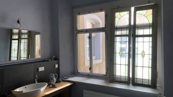 Shower, hair dryer, towels, soap