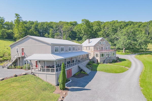 Inn is the larger building to the left. Stone House is a separate rental.