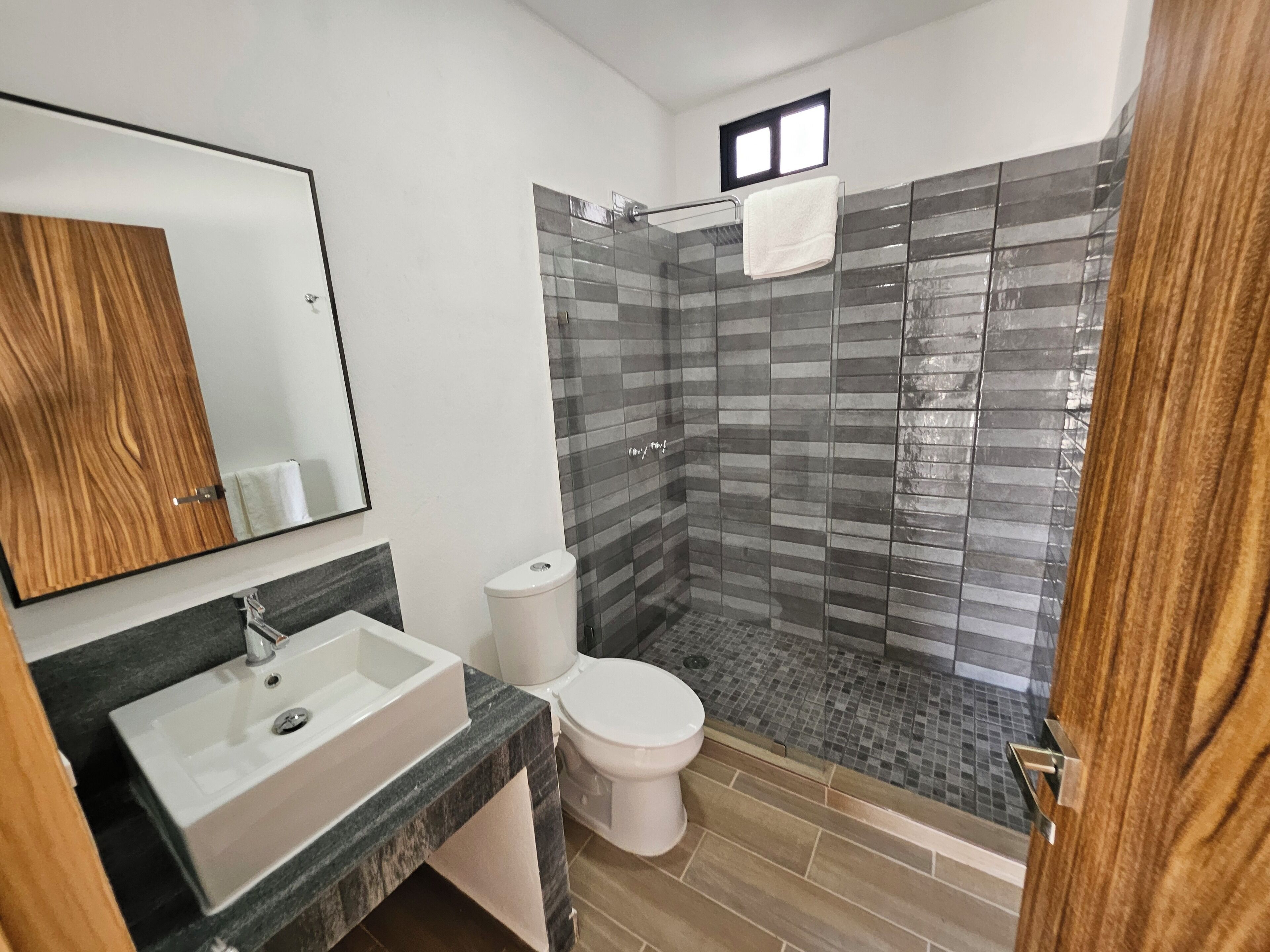 grand apartment | bathroom | shower, rainfall showerhead, free toiletries, towels