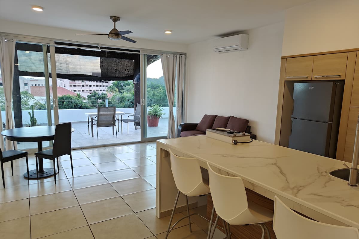 Room | Living area | 50-inch Smart TV with digital channels, streaming services