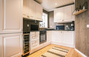 Fridge, stovetop, dishwasher, coffee/tea maker