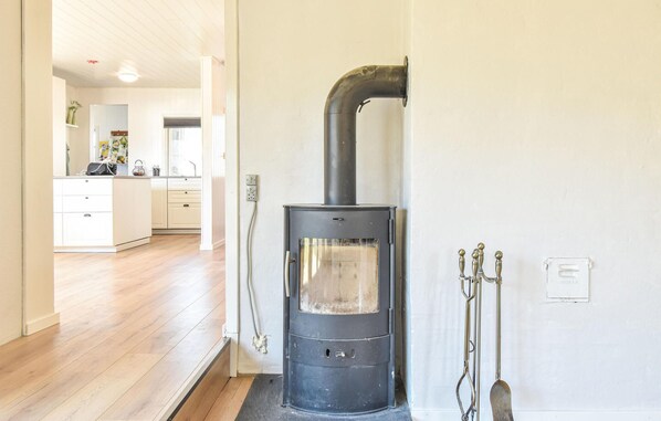 A modern kitchen with white cabinets and a built-in stove. - Stunning home in Frørup with WiFi (Frørup)