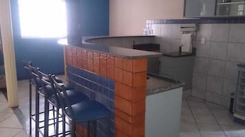 Fridge, stovetop, dining tables