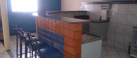 Fridge, stovetop, dining tables