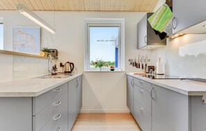 Fridge, stovetop, dishwasher, coffee/tea maker